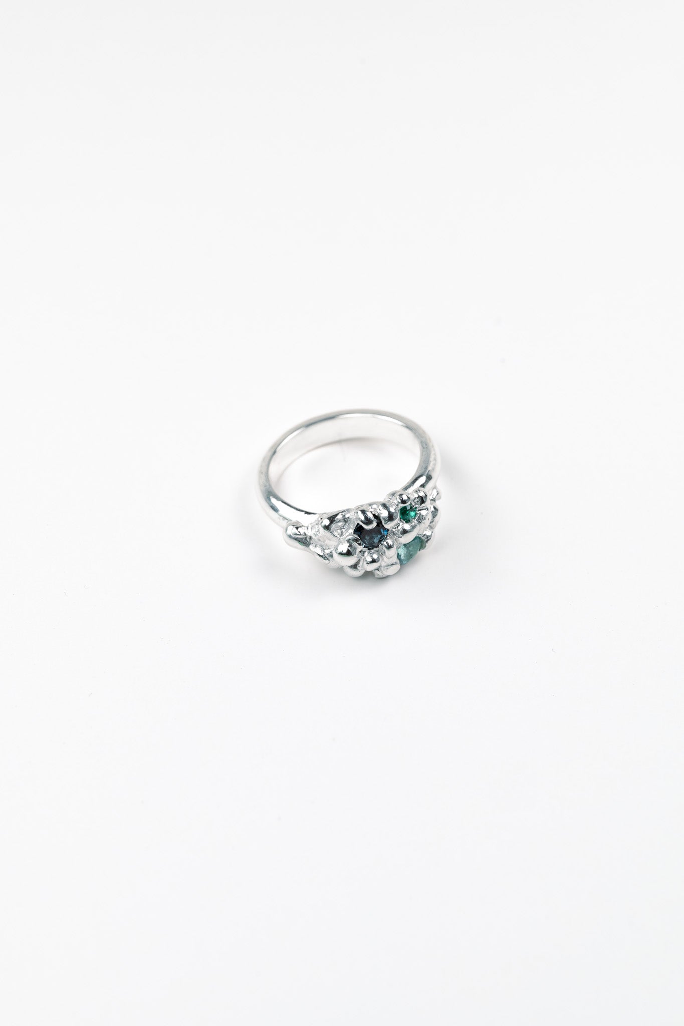 Organic sculptural silver ring with scattered gemstones
