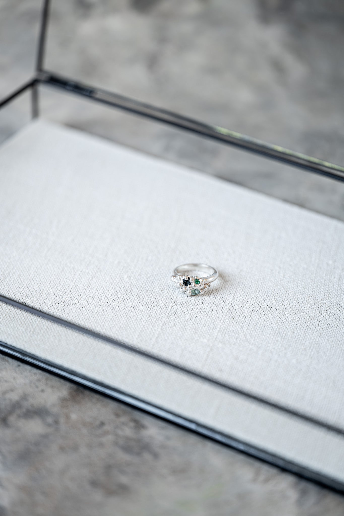 Organic sculptural silver ring with scattered gemstones