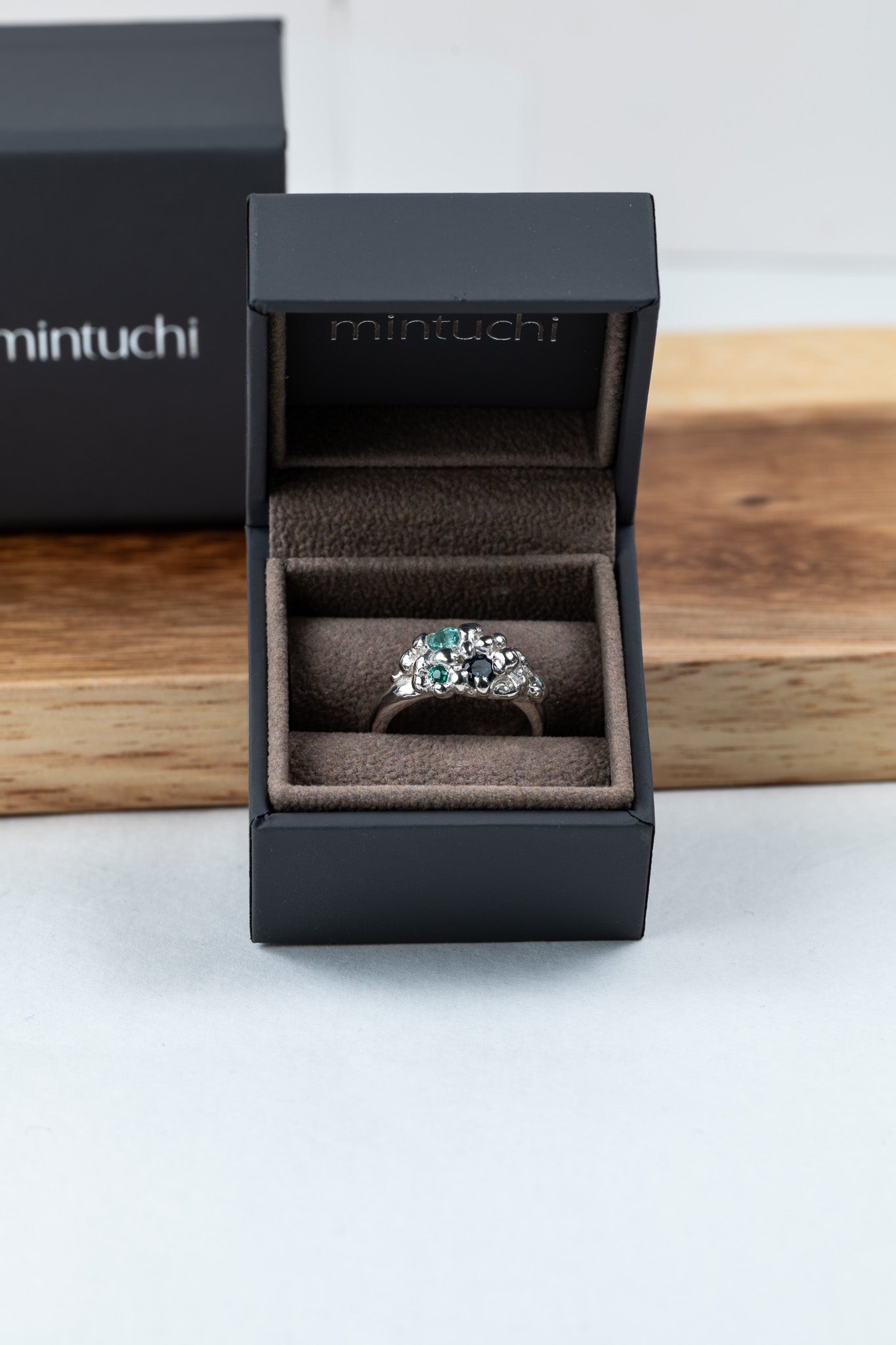 Organic sculptural silver ring with scattered gemstones