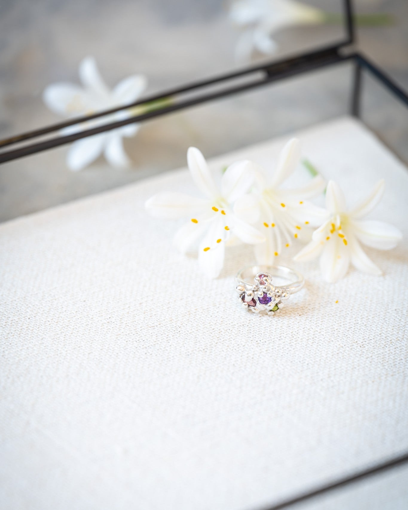 White flower arrangement on a white surface with a blurred background